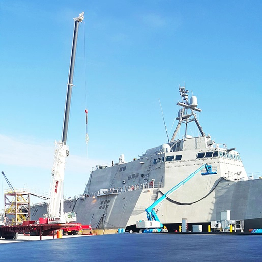 Crane in front of a large ship