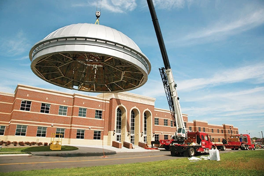 crane lifting building dome