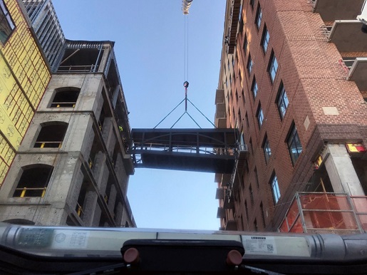 Team effort helps lift and set pedestrian bridge in Wilmington, North Carolina