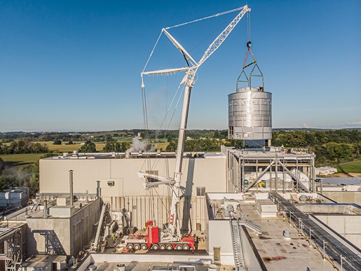 Crane lifting whey dryer into its permanent position