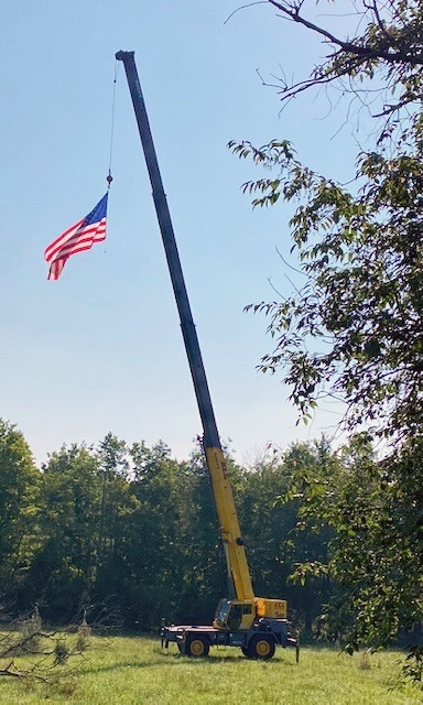 ALL Crane lifting American flag