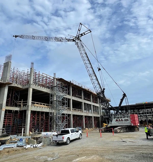 Compaction Jackson CS 1 Lattice crawler crane working on a building