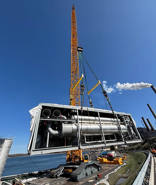 Determined on the Mount CS 1 yellow crawler working on a power generation plant