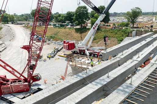 Four Rings Case Study Image 1 Red crawler and white AT working on a bridge