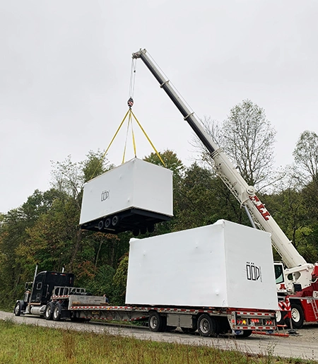 Read GLASS HOUSES ALL Liebherr LTM lifting load off of trailer