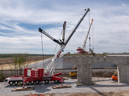 Cranes constructing a new vehicle overpass