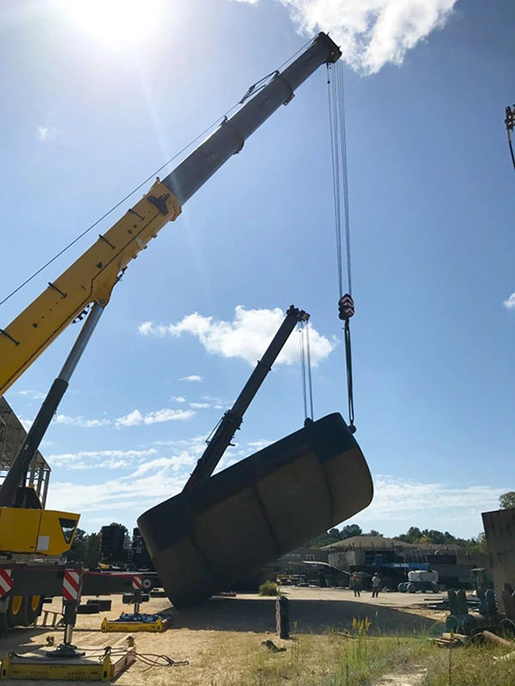 crane lifting part of ship