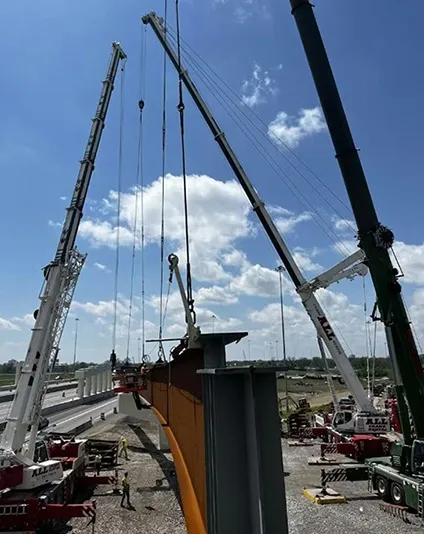 Group of cranes working on a highway