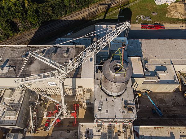 Crane lifting whey dryer into its permanent position