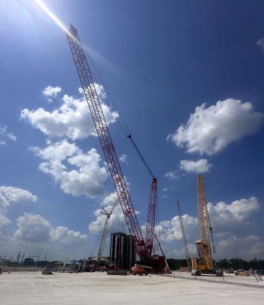 red crawler crane working on power plant