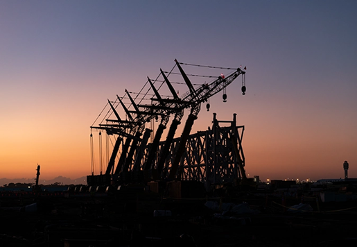 Seven-crane lift at sunset