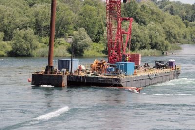300-ton Manitowoc 2250 crawler crane on a floating barge,