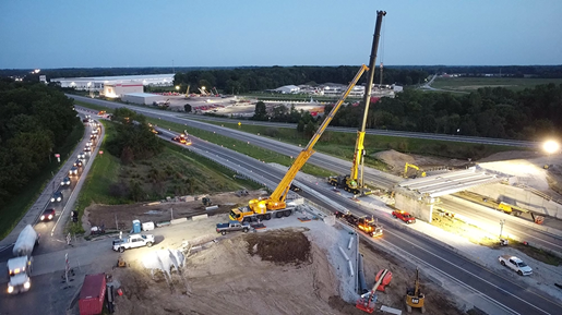 Two all-terrain cranes dual-picking for a bridge over Indiana I-74