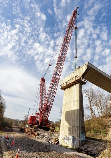 Crawler crane working on bridge