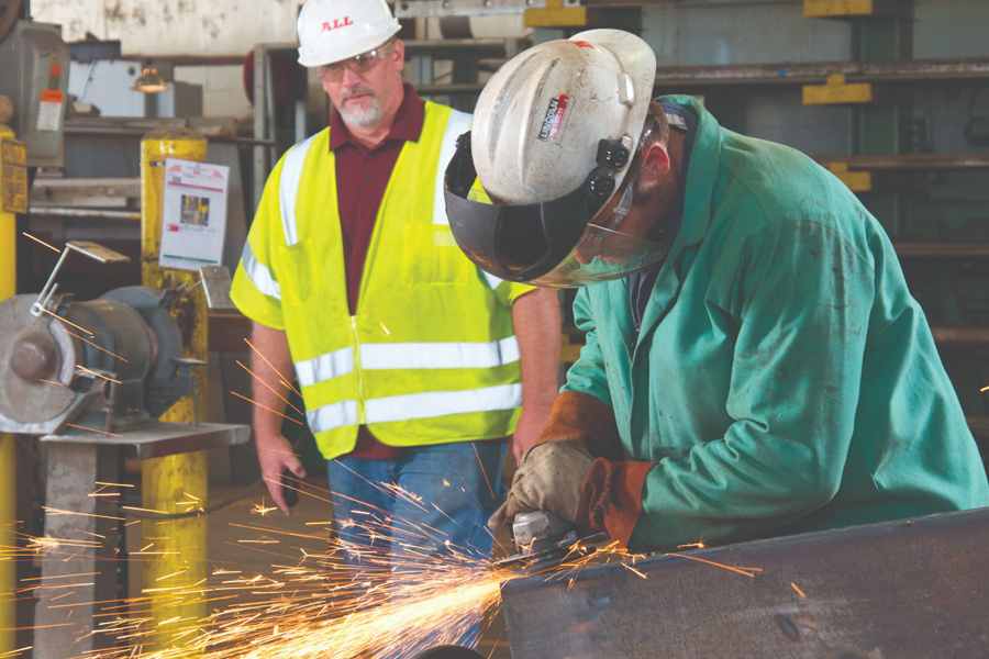 Engineers working in shop